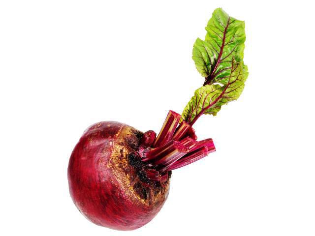 A red beet with greens attached.