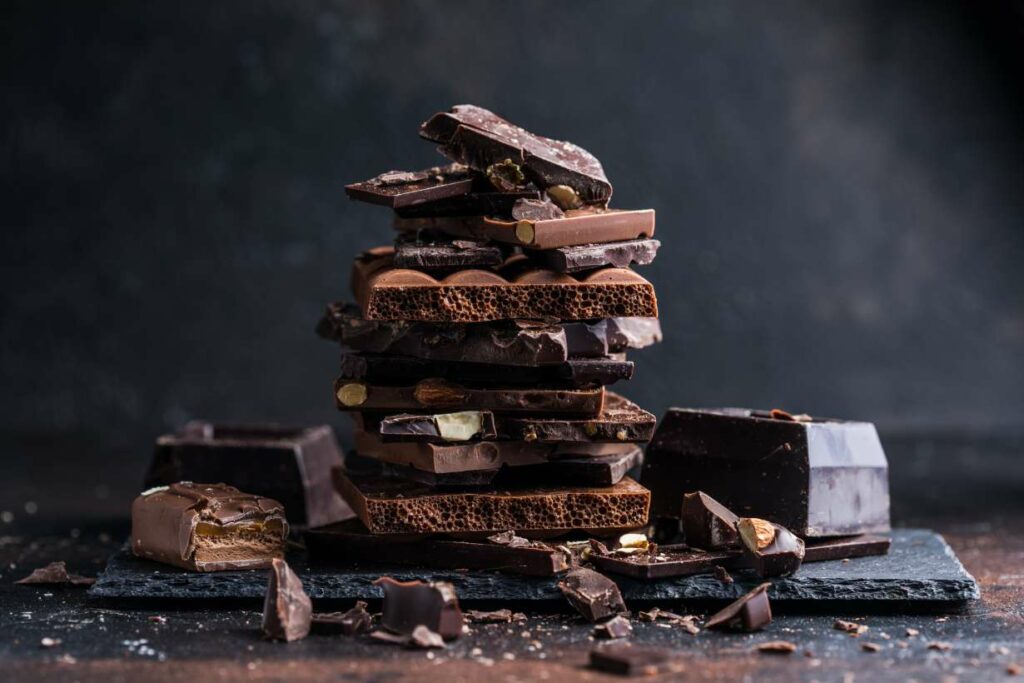 Various Dark Chocolate Bars In a Pile.