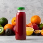 Fruit Juice With Various Fruits In the Background.