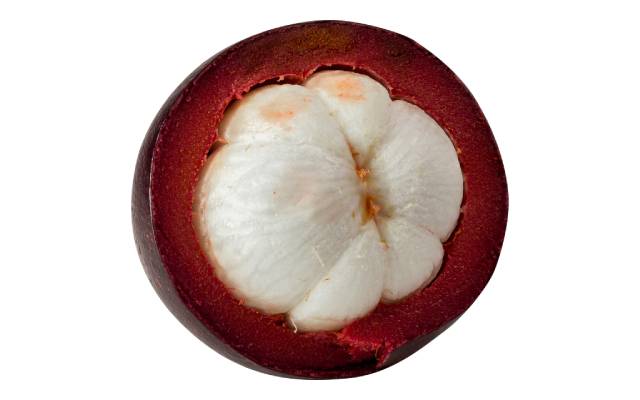 The inside flesh of a mangosteen cut into half.