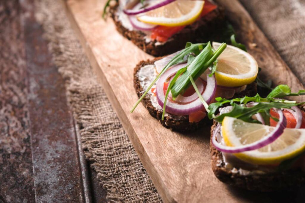 Rye bread with salmon and salad - typical Nordic Diet food.