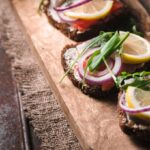 Rye bread with salmon and salad - typical Nordic Diet food.