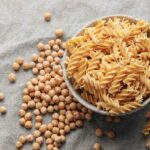 Dried chickpea pasta in a bowl.