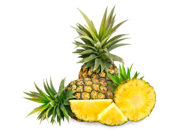 Cut pineapple showing bright yellow pineapple flesh.