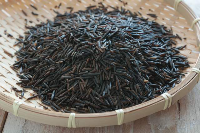 Wild rice in a wooden container.