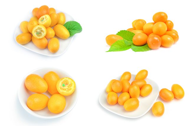 Piles of kumquats on small white plates.