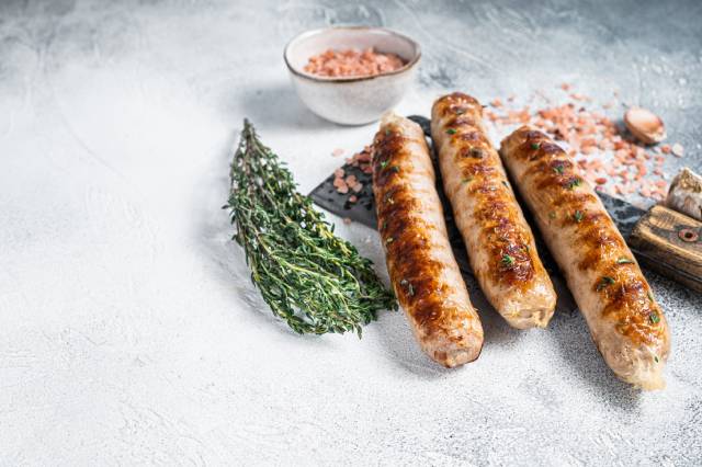 Three whole bockwurst sausages.