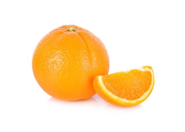 A whole Valencia orange next to a single slice.