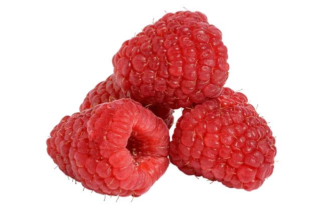 A close-up image of three red raspberries.