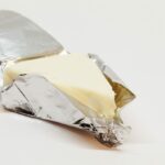 A Triangular Wedge of Laughing Cow Cheese Wrapped In Foil.