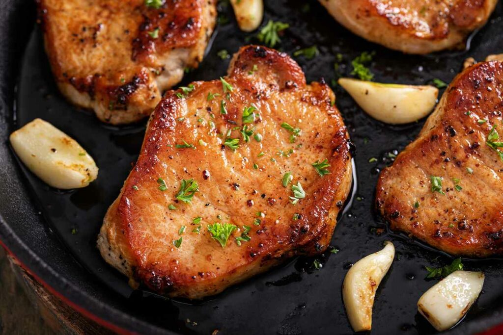 Grilled pork loin in a cast iron pan.