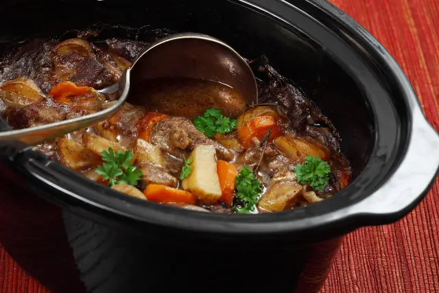 Cooked Irish stew in a slow cooker pot.