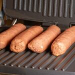 Four Beyond Sausage Links On a Grill.