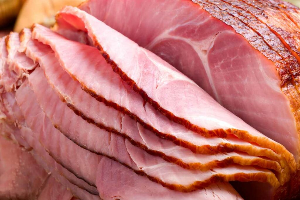 A joint of cooked ham that has been cut into slices.