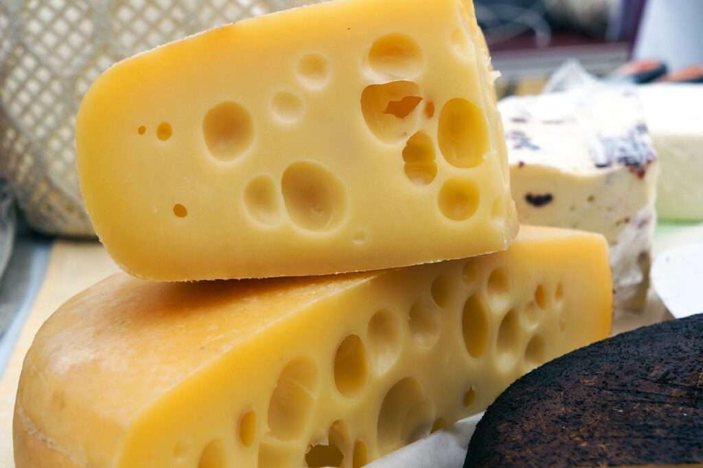 A close-up image of Swiss cheese.