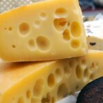 A close-up image of Swiss cheese.