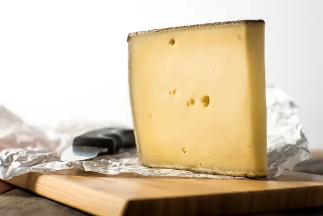 A large piece of Gruyere cheese.