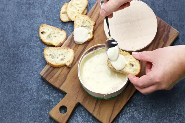 A melted box of Vacherin Mont d'Or cheese.