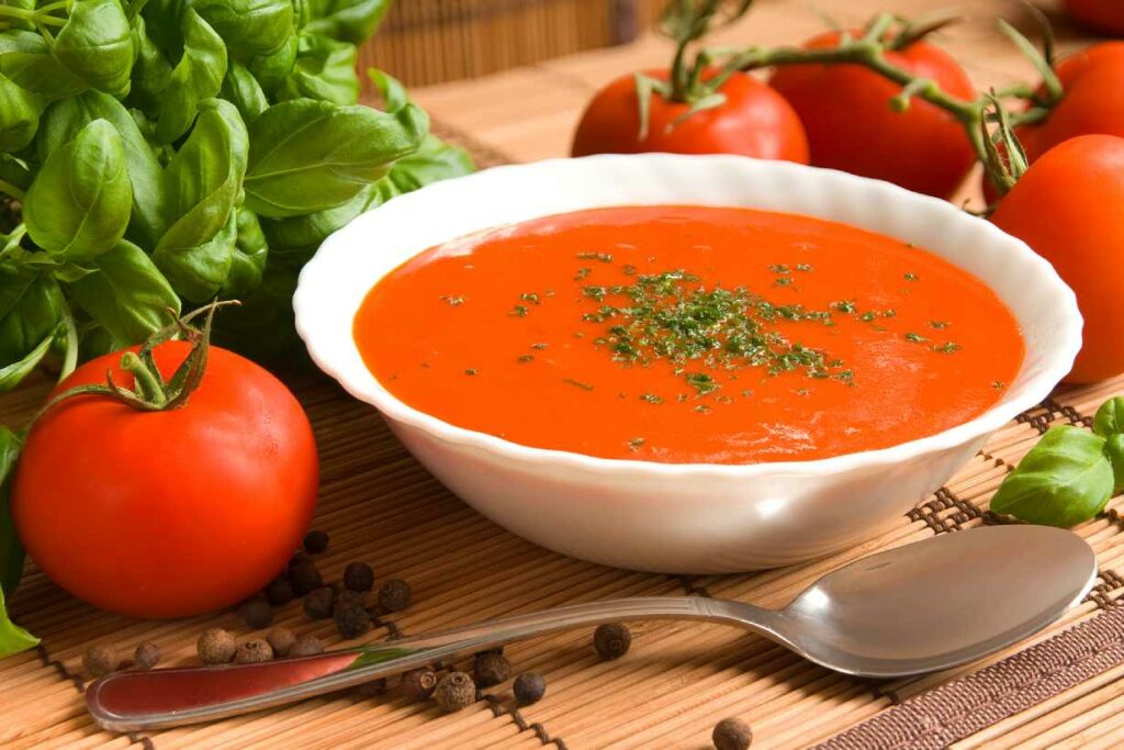 Tomato soup in a white bowl.