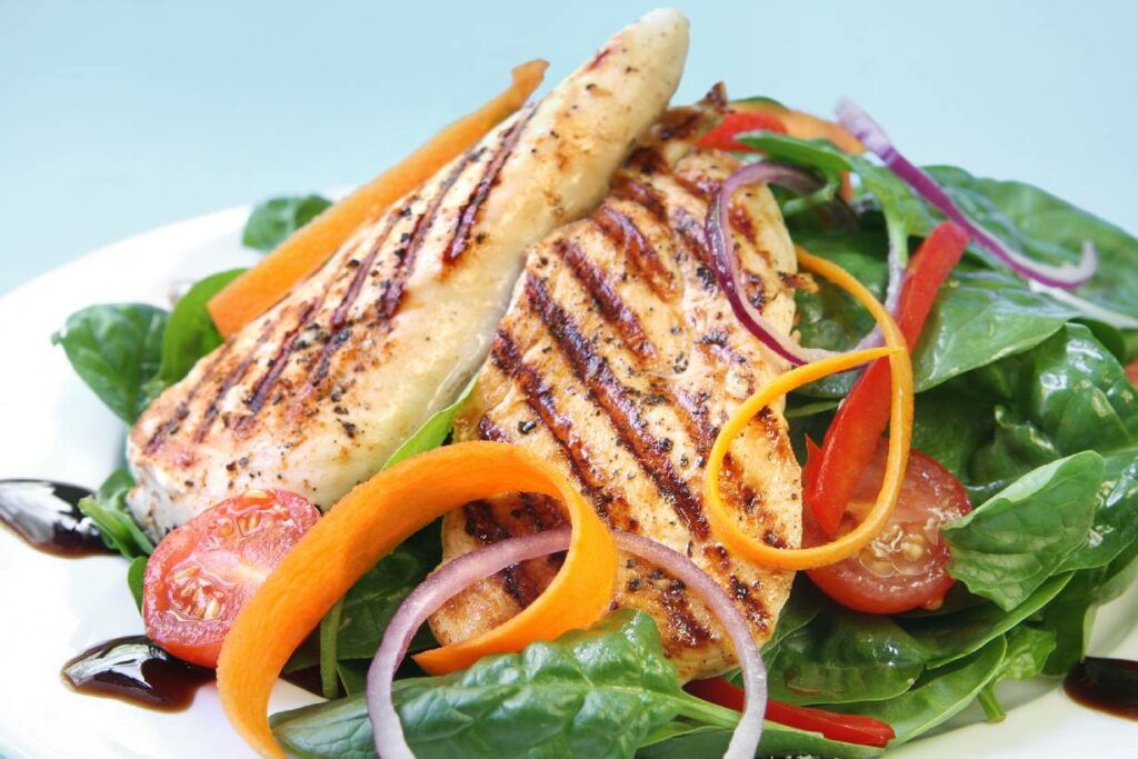 Grilled chicken breast with low-calorie vegetables.
