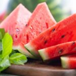 Several wedge slices of watermelon showing the inner red flesh and seeds.