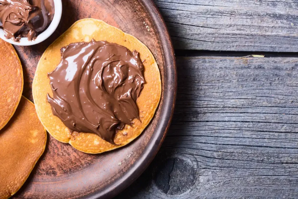 Nutella spread on pancakes.