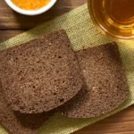 Three slices of traditional German pumpernickel bread.