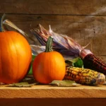 Pumpkin: Potential Benefits and Full Nutrition Facts Pumpkins on a wooden shelf.