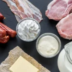 Foods high in saturated fat: butter, bacon, sausages, and cream.