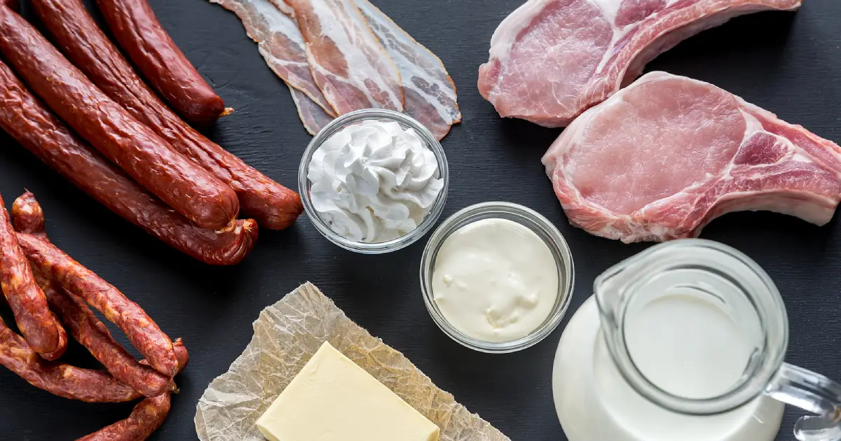 Foods high in saturated fat: butter, bacon, sausages, and cream.