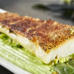 Halibut: Nutrition, Benefits, and Drawbacks A Baked fillet of halibut on a plate.