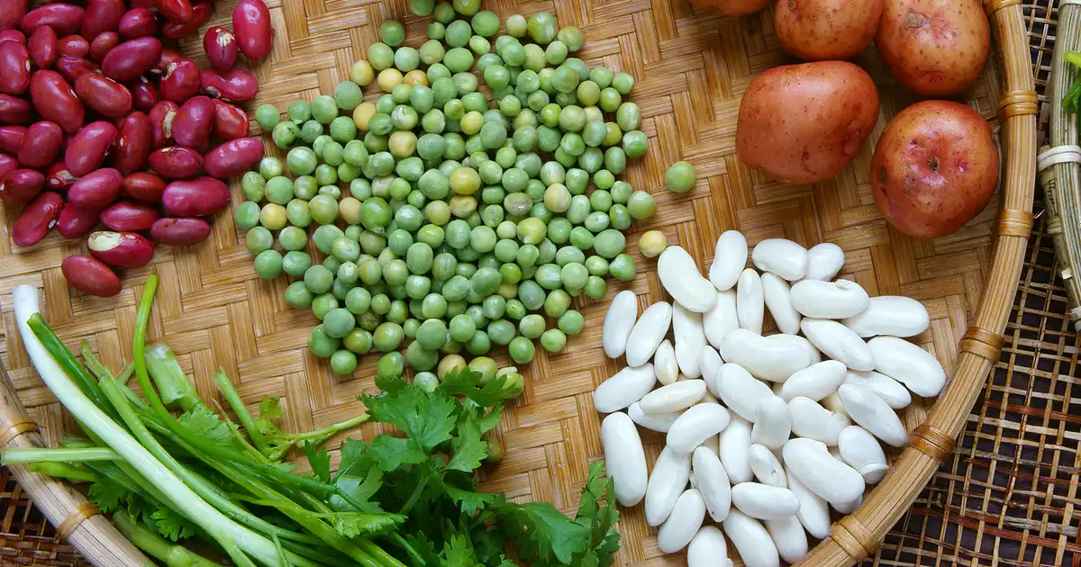 Various whole foods high in carbs: potatoes, beans, green peas.