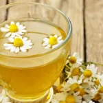 Does Chamomile Tea Help You Sleep? Benefits + Research A glass cup of chamomile tea.